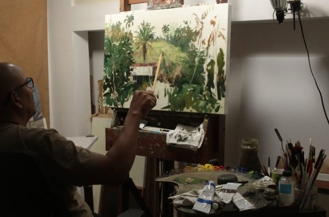 William pintando un paisaje en el caballete